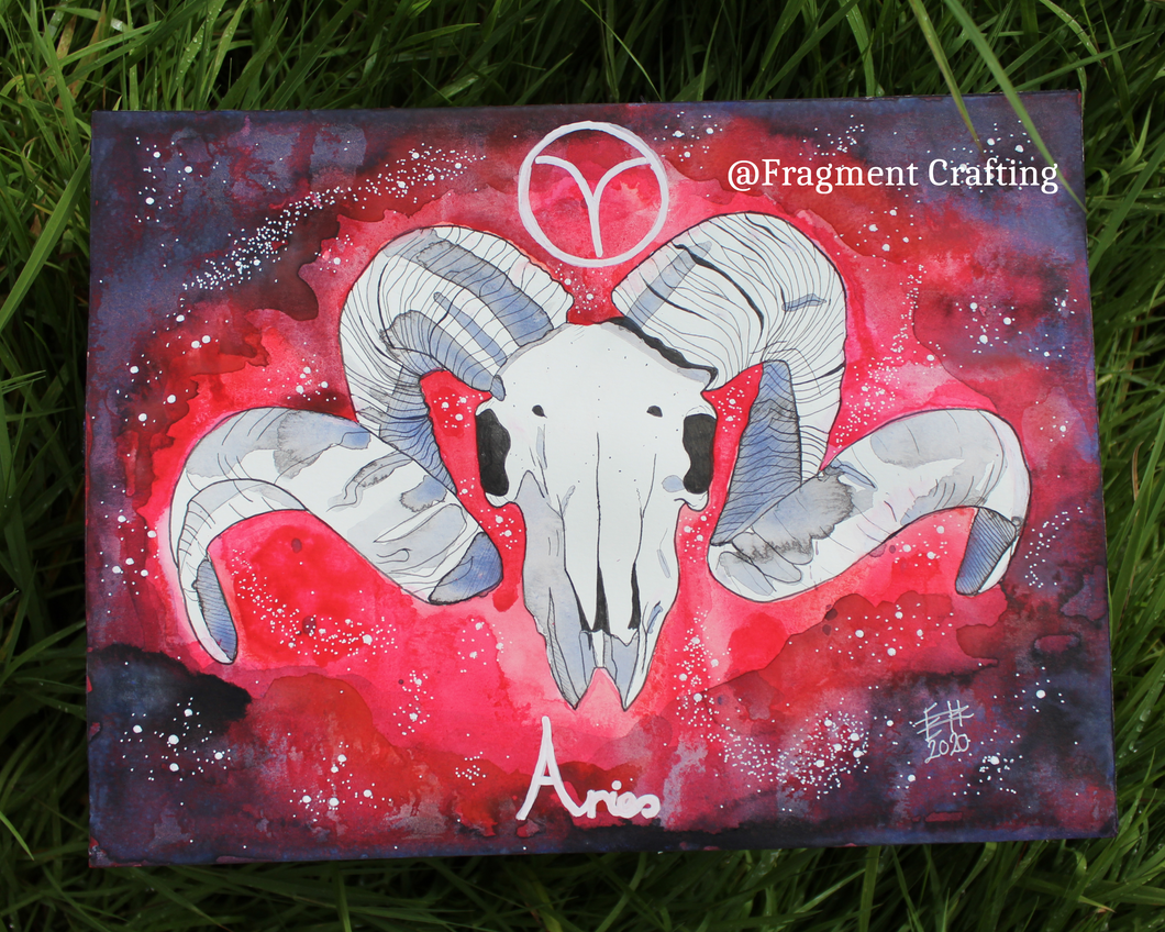 An original watercolour painting of Aries star sign with a red and purple background with a white Ram's skull on the grass.