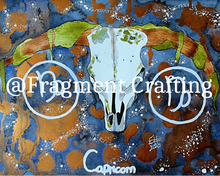 Load image into Gallery viewer, A print copy of a Capricorn star sign watercolour painting with a grey and orange background and white sea goat skull.
