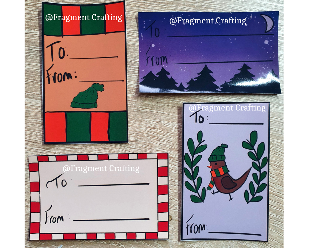 A pack of four Christmas To and From stickers with robins, hats and trees.