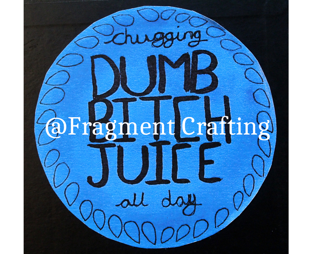 A round sticker with a blue background and black writing saying chugging dumb bitch juice all day.