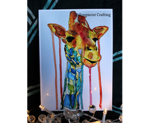 Load image into Gallery viewer, A print copy of a watercolour painting of a giraffe&#39;s neck and head being showcased on a fabric backdrop.
